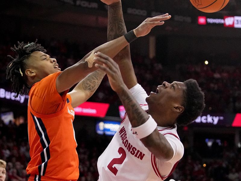 Mar 2, 2024; Madison, WI, USA;  Illinois guard Terrence Shannon Jr. (0) fouls Wisconsin guard AJ Storr (2) during the second half of their game Saturday, March 2, 2024 at the Kohl Center in Madison, Wisconsin.  Mandatory Credit: Mark Hoffman-USA TODAY Sports
