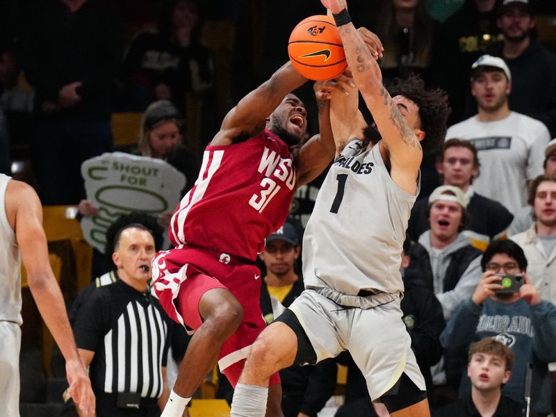 Dec 31, 2023; Boulder, Colorado, USA;Colorado Buffaloes guard J'Vonne Hadley (1) blocks the shot of Colorado Buffaloes guard Harrison Carrington (31) in the second half at the CU Events Center. Mandatory Credit: Ron Chenoy-USA TODAY Sports