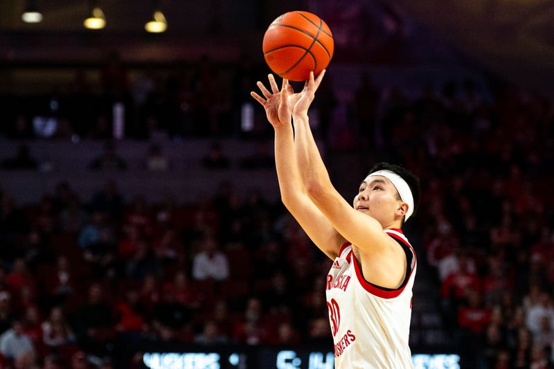 Jan 23, 2024; Lincoln, Nebraska, USA; Nebraska Cornhuskers guard Keisei Tominaga (30) shoots a 3-point shot against the Ohio State Buckeyes during the first half at Pinnacle Bank Arena. Mandatory Credit: Dylan Widger-USA TODAY Sports