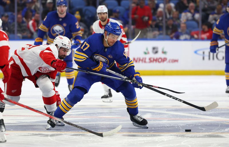 Dec 5, 2023; Buffalo, New York, USA;  Detroit Red Wings center Dylan Larkin (71) and Buffalo Sabres center Tyson Jost (17) go after a loose puck during the second period at KeyBank Center. Mandatory Credit: Timothy T. Ludwig-USA TODAY Sports