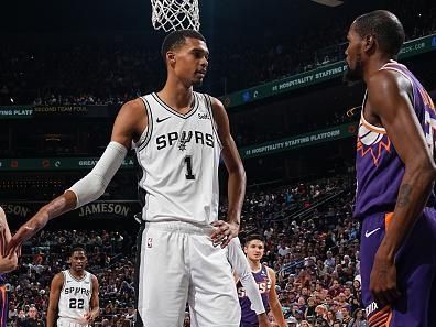 PHOENIX, AZ - NOVEMBER 2: Victor Wembanyama #1 of the San Antonio Spurs and Kevin Durant #35 of the Phoenix Suns talk during the game on November 2, 2023 at Footprint Center in Phoenix, Arizona. NOTE TO USER: User expressly acknowledges and agrees that, by downloading and or using this photograph, user is consenting to the terms and conditions of the Getty Images License Agreement. Mandatory Copyright Notice: Copyright 2023 NBAE (Photo by Garrett Ellwood/NBAE via Getty Images)