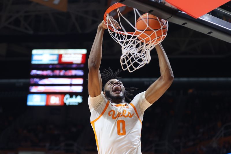 Feb 28, 2023; Knoxville, Tennessee, USA; Tennessee Volunteers forward Jonas Aidoo (0) dunks the ball against the Arkansas Razorbacks during the second half at Thompson-Boling Arena. Mandatory Credit: Randy Sartin-USA TODAY Sports