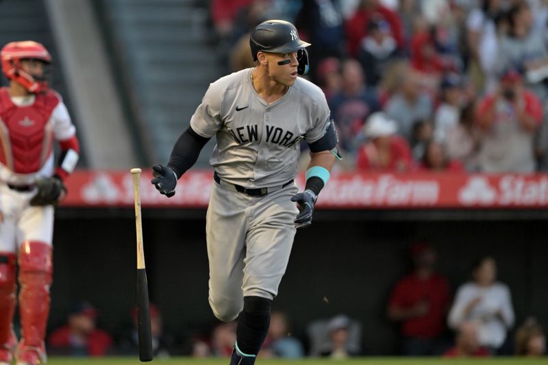 May 30, 2024; Anaheim, California, USA;  New York Yankees center fielder Aaron Judge (99) heads to first on a two-run home run scoring right fielder Juan Soto (22) in the fourth inning against the Los Angeles Angels at Angel Stadium. Mandatory Credit: Jayne Kamin-Oncea-USA TODAY Sports