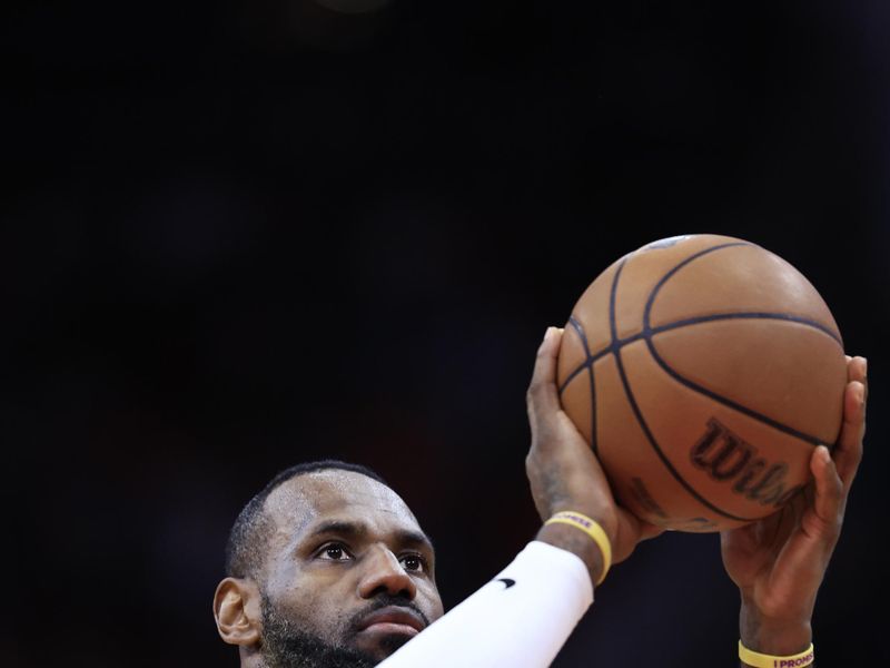 HOUSTON, TEXAS - JANUARY 29: LeBron James #23 of the Los Angeles Lakers shoots a free throw against the Houston Rockets during the first half at Toyota Center on January 29, 2024 in Houston, Texas. NOTE TO USER: User expressly acknowledges and agrees that, by downloading and or using this photograph, User is consenting to the terms and conditions of the Getty Images License Agreement.? (Photo by Carmen Mandato/Getty Images)