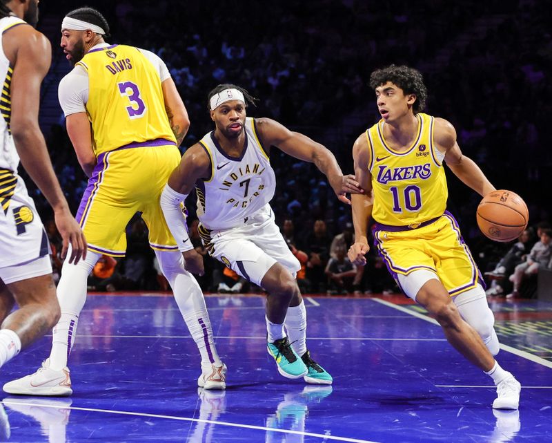 LAS VEGAS, NEVADA - DECEMBER 09: Max Christie #10 of the Los Angeles Lakers drives against Buddy Hield #7 of the Indiana Pacers in the first quarter of the championship game of the inaugural NBA In-Season Tournament at T-Mobile Arena on December 09, 2023 in Las Vegas, Nevada. The Lakers defeated the Pacers 123-109. NOTE TO USER: User expressly acknowledges and agrees that, by downloading and or using this photograph, User is consenting to the terms and conditions of the Getty Images License Agreement. (Photo by Ethan Miller/Getty Images)