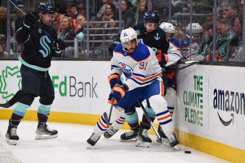 Mar 2, 2024; Seattle, Washington, USA; Edmonton Oilers left wing Evander Kane (91) and Seattle Kraken defenseman Brian Dumoulin (8) play the puck against the wall during the first period at Climate Pledge Arena. Mandatory Credit: Steven Bisig-USA TODAY Sports