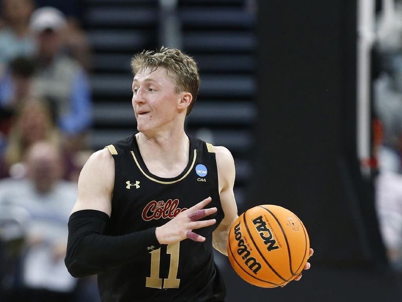 Mar 16, 2023; Orlando, FL, USA; College of Charleston Cougars guard Ryan Larson (11) controls the ball during the first half against the San Diego State Aztecs at Amway Center. Mandatory Credit: Russell Lansford-USA TODAY Sports