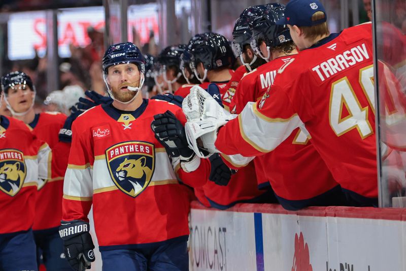Nov 1, 2025; Sunrise, Florida, USA; Florida Panthers center Sam Bennett (9) celebrates with teammates after scoring against the Dallas Stars during the third period at Amerant Bank Arena. Mandatory Credit: Sam Navarro-Imagn Images