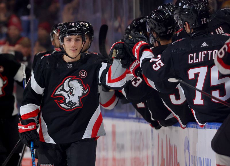 Jan 11, 2024; Buffalo, New York, USA;  Buffalo Sabres center Peyton Krebs (19) celebrates his goal with teammates during the second period against the Ottawa Senators at KeyBank Center. Mandatory Credit: Timothy T. Ludwig-USA TODAY Sports