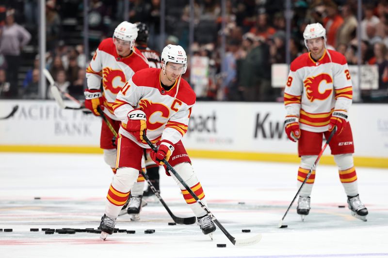 Dec 21, 2023; Anaheim, California, USA;  Calgary Flames center Mikael Backlund (11) warms up before the game against the Anaheim Ducks at Honda Center. Mandatory Credit: Kiyoshi Mio-USA TODAY Sports