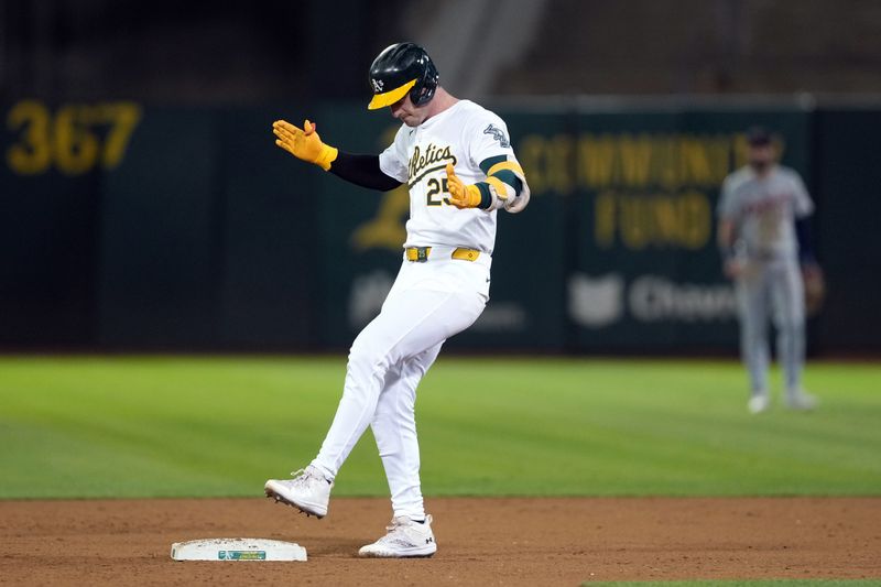 Sep 6, 2024; Oakland, California, USA; Oakland Athletics designated hitter Brent Rooker (25) reacts after hitting an RBI-double against the Detroit Tigers during the tenth inning at Oakland-Alameda County Coliseum. Mandatory Credit: Darren Yamashita-Imagn Images