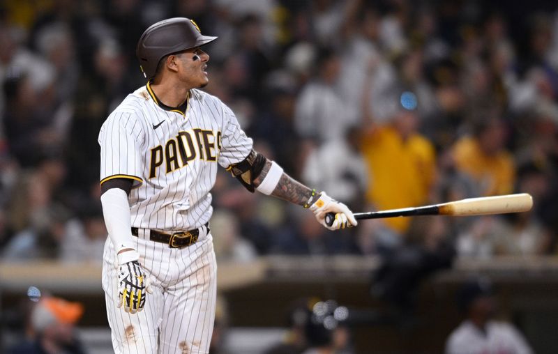 Apr 14, 2022; San Diego, California, USA; San Diego Padres third baseman Manny Machado (13) watches his two-run home run during the seventh inning against the Atlanta Braves at Petco Park. Mandatory Credit: Orlando Ramirez-USA TODAY Sports