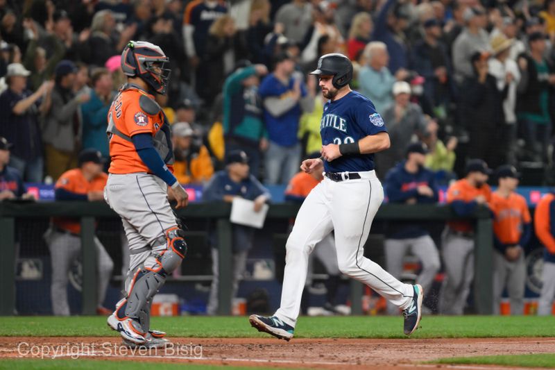 Sep 27, 2023; Seattle, Washington, USA; Seattle Mariners catcher Cal Raleigh (29) scores a run against the Houston Astros during the fourth inning at T-Mobile Park. Mandatory Credit: Steven Bisig-USA TODAY Sports