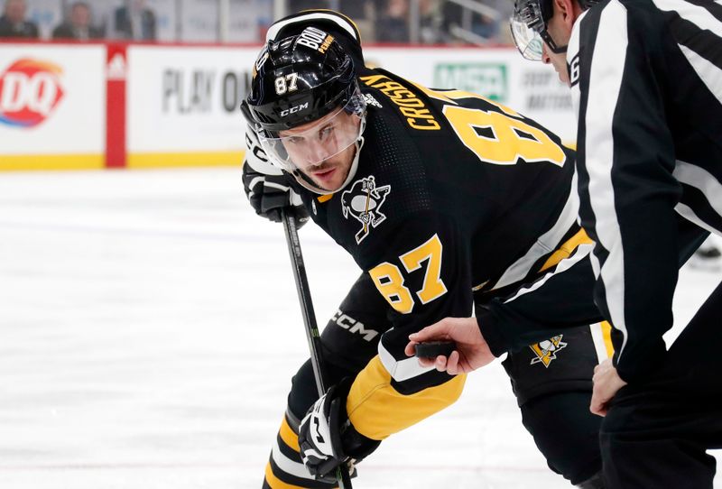 Jan 11, 2024; Pittsburgh, Pennsylvania, USA; Pittsburgh Penguins center Sidney Crosby (87) waits for the puck drop on a face-off against the Vancouver Canucks during the first period at PPG Paints Arena. Mandatory Credit: Charles LeClaire-USA TODAY Sports