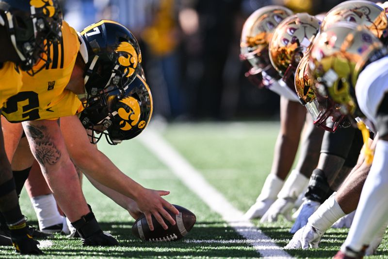 Oct 21, 2023; Iowa City, Iowa, USA; The line of scrimmage between the Iowa Hawkeyes and the Minnesota Golden Gophers during the first quarter at Kinnick Stadium. Mandatory Credit: Jeffrey Becker-USA TODAY Sports