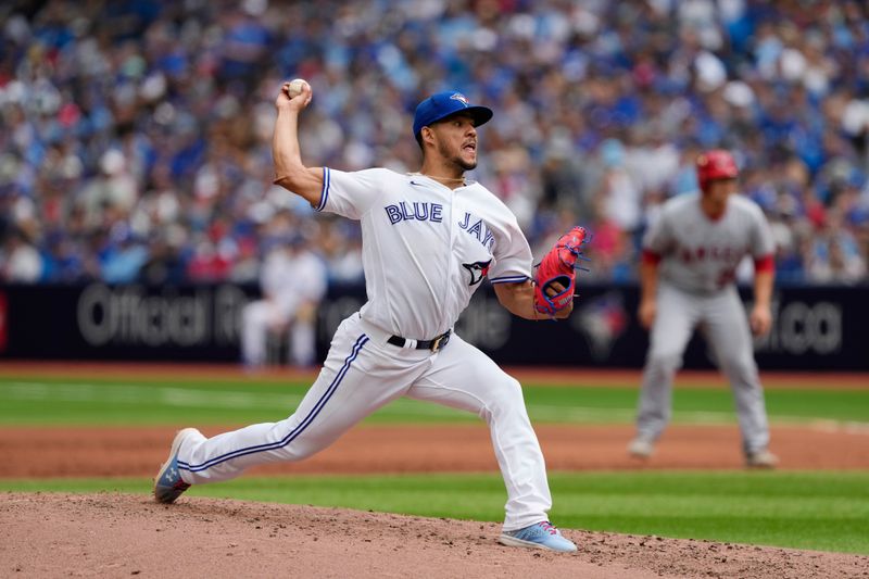 Jul 30, 2023; Toronto, Ontario, CAN; Toronto Blue Jays starting pitcher Jose Berrios (17) pitches to the Los Angeles Angels during the third inning at Rogers Centre. Mandatory Credit: John E. Sokolowski-USA TODAY Sports