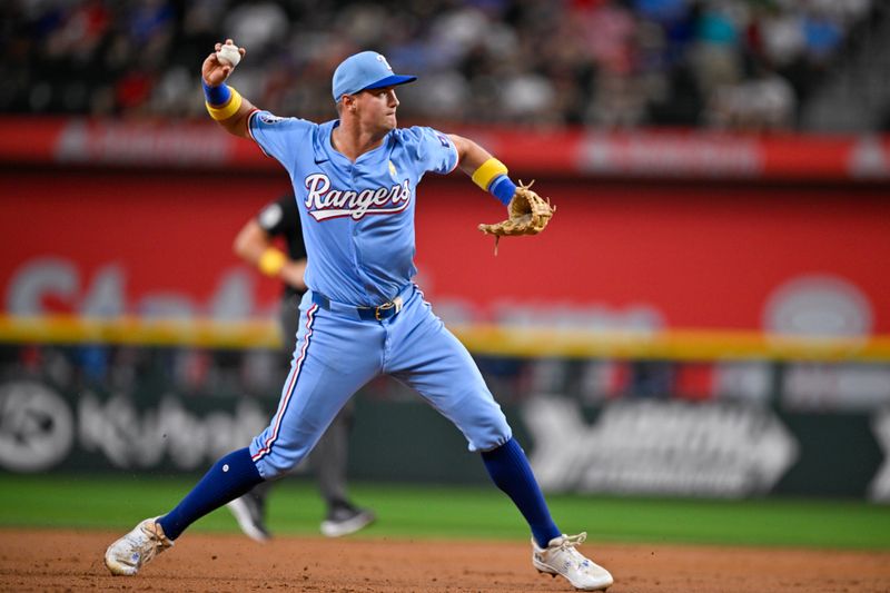 Sep 1, 2024; Arlington, Texas, USA; Texas Rangers third baseman Josh Jung (6) throws to first base during the third inning at Globe Life Field. Mandatory Credit: Jerome Miron-USA TODAY Sports