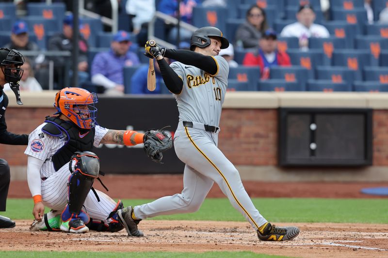 Apr 17, 2024; New York City, New York, USA; Pittsburgh Pirates designated hitter Bryan Reynolds (10) follows through on an RBI infield single against the New York Mets during the third inning at Citi Field. Mandatory Credit: Brad Penner-USA TODAY Sports