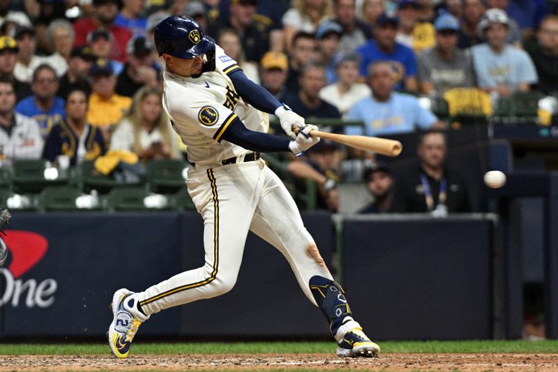 Oct 3, 2023; Milwaukee, Wisconsin, USA; Milwaukee Brewers shortstop Willy Adames (27) singles in the seventh inning against the Arizona Diamondbacks during game one of the Wildcard series for the 2023 MLB playoffs at American Family Field. Mandatory Credit: Michael McLoone-USA TODAY Sports