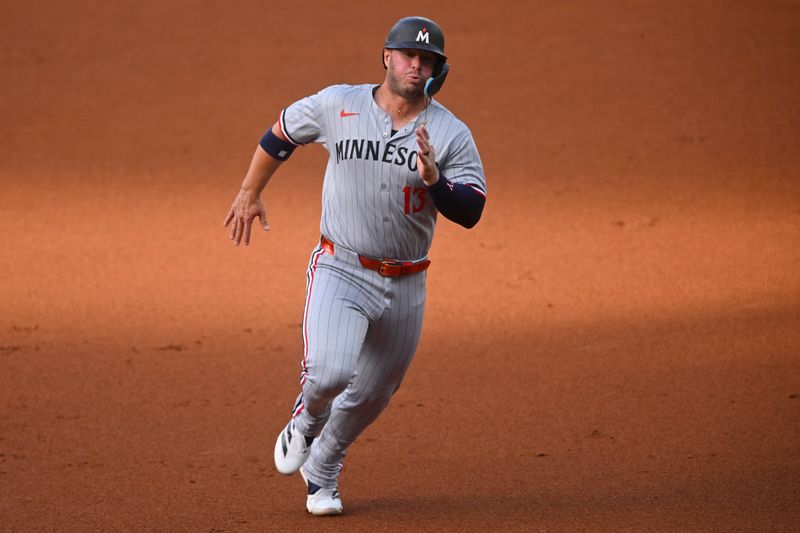 Apr 28, 2025; Cleveland, Ohio, USA; Minnesota Twins first baseman Ty France (13) runs the bases in the first inning against the Cleveland Guardians at Progressive Field. Mandatory Credit: David Richard-Imagn Images