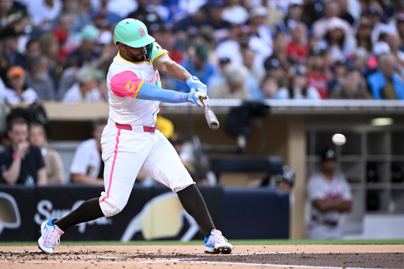 Jul 12, 2024; San Diego, California, USA; San Diego Padres second baseman Xander Bogaerts (2) hits a single against the Atlanta Braves during the second inning at Petco Park. Mandatory Credit: Orlando Ramirez-USA TODAY Sports 
