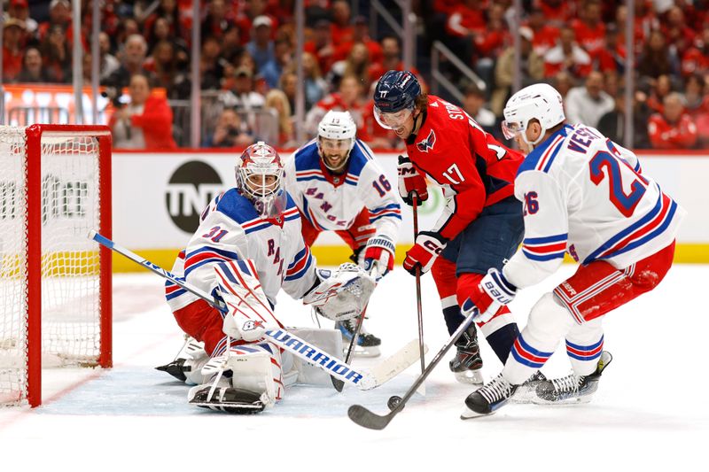 Apr 26, 2024; Washington, District of Columbia, USA; New York Rangers goaltender Igor Shesterkin (31) makes a save on Washington Capitals center Dylan Strome (17) as Rangers left wing Jimmy Vesey (26) defends in the third period in game three of the first round of the 2024 Stanley Cup Playoffs at Capital One Arena. Mandatory Credit: Geoff Burke-USA TODAY Sports