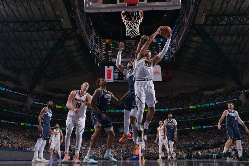 DALLAS, TX - MARCH 17: Aaron Gordon #50 of the Denver Nuggets drives to the basket during the game against the Dallas Mavericks on March 17, 2024 at the American Airlines Center in Dallas, Texas. NOTE TO USER: User expressly acknowledges and agrees that, by downloading and or using this photograph, User is consenting to the terms and conditions of the Getty Images License Agreement. Mandatory Copyright Notice: Copyright 2024 NBAE (Photo by Glenn James/NBAE via Getty Images)