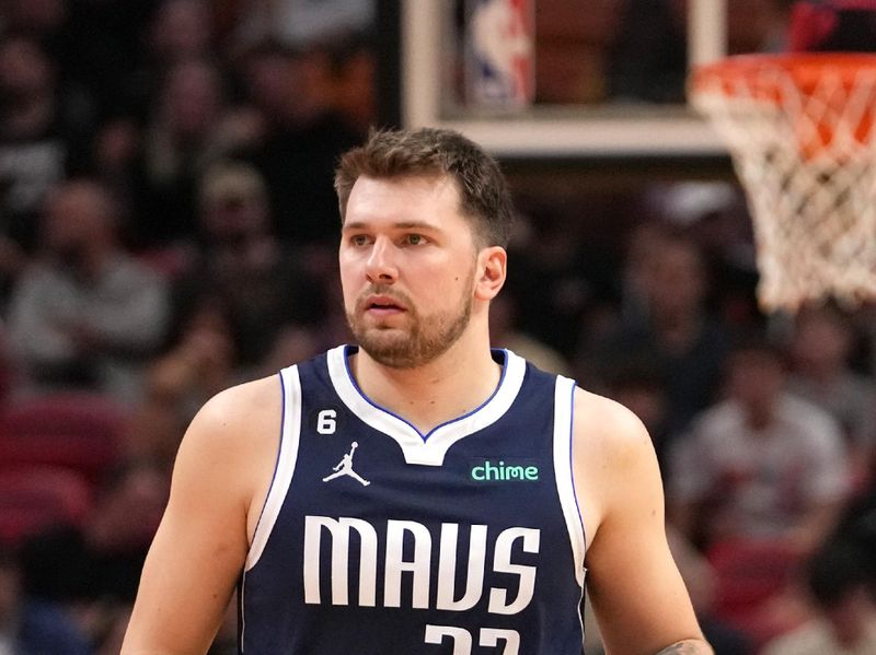 MIAMI, FL - APRIL 1:  Luka Doncic #77 of the Dallas Mavericks dribbles the ball against the Miami Heat on April 1, 2023 at FTX Arena in Miami, Florida. NOTE TO USER: User expressly acknowledges and agrees that, by downloading and or using this Photograph, user is consenting to the terms and conditions of the Getty Images License Agreement. Mandatory Copyright Notice: Copyright 2023 NBAE (Photo by Issac Baldizon/NBAE via Getty Images)