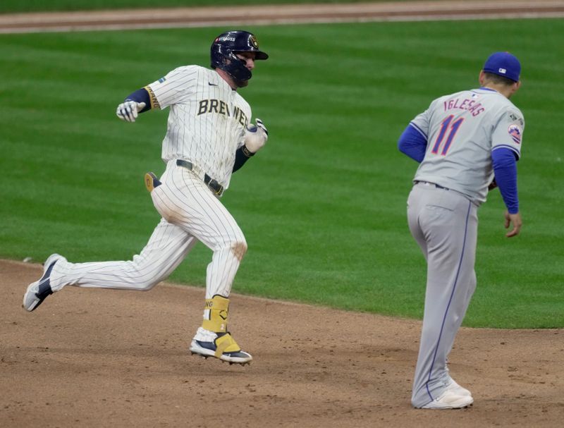 Oct 2, 2024; Milwaukee, Wisconsin, USA; Milwaukee Brewers second baseman Brice Turang (2) hits a double during the fifth inning against the New York Mets in game two of their wild-card playoff game at American Family Field. Mandatory Credit: Mark Hoffman-Imagn Images