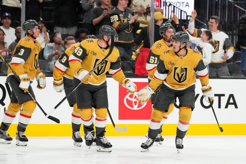 Oct 9, 2024; Las Vegas, Nevada, USA; Vegas Golden Knights defenseman Zach Whitecloud (2) skates off the ice with teammates after scoring a goal against the Colorado Avalanche during the second period at T-Mobile Arena. Mandatory Credit: Lucas Peltier-Imagn Images