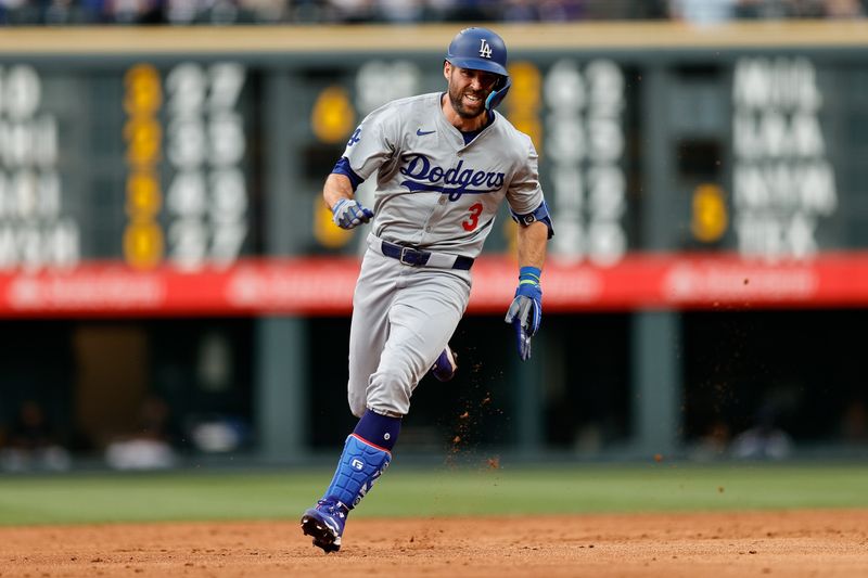 Jun 18, 2024; Denver, Colorado, USA; Los Angeles Dodgers second baseman Chris Taylor (3) runs to third on a triple in the third inning against the Colorado Rockies at Coors Field. Mandatory Credit: Isaiah J. Downing-USA TODAY Sports