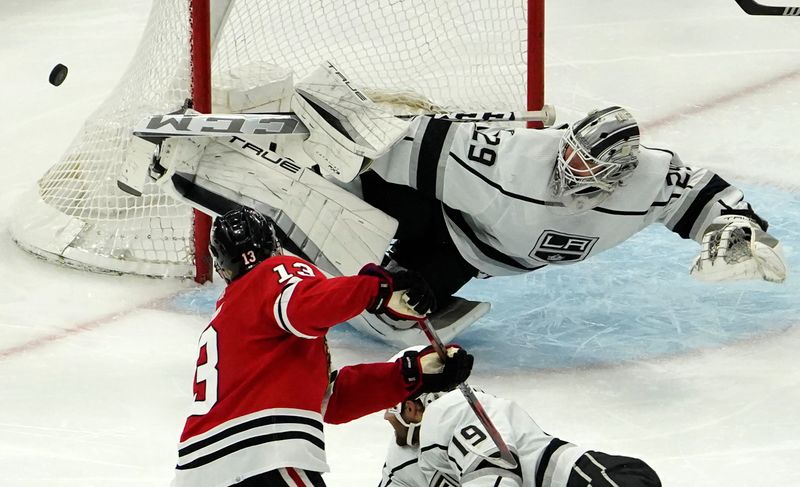 Jan 22, 2023; Chicago, Illinois, USA; Los Angeles Kings goaltender Pheonix Copley (29) makes a save on Chicago Blackhawks center Max Domi (13) during the third period at United Center. Mandatory Credit: David Banks-USA TODAY Sports