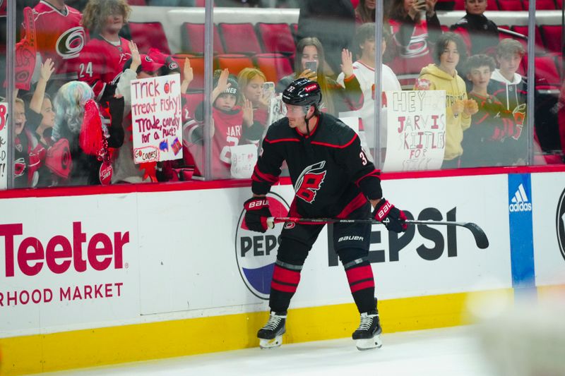 Oct 27, 2023; Raleigh, North Carolina, USA; Carolina Hurricanes right wing Andrei Svechnikov (37) looks at the fans before the game against the San Jose Sharks at PNC Arena. Mandatory Credit: James Guillory-USA TODAY Sports