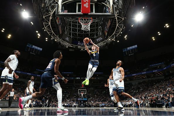 MINNEAPOLIS, MN -  NOVEMBER 1: Christian Braun #0 of the Denver Nuggets drives to the basket during the game against the Minnesota Timberwolves on November 1, 2023 at Target Center in Minneapolis, Minnesota. NOTE TO USER: User expressly acknowledges and agrees that, by downloading and or using this Photograph, user is consenting to the terms and conditions of the Getty Images License Agreement. Mandatory Copyright Notice: Copyright 2023 NBAE (Photo by David Sherman/NBAE via Getty Images)