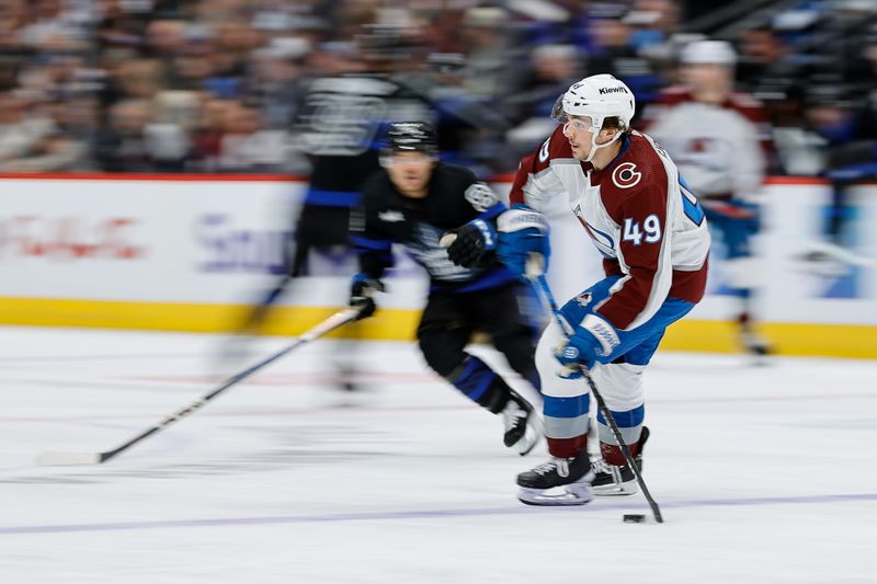 Feb 24, 2024; Denver, Colorado, USA; Colorado Avalanche defenseman Samuel Girard (49) controls the puck in the third period against the Toronto Maple Leafs at Ball Arena. Mandatory Credit: Isaiah J. Downing-USA TODAY Sports