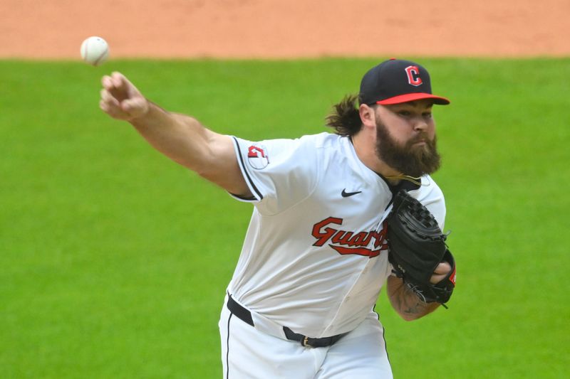 Jun 22, 2024; Cleveland, Ohio, USA; Cleveland Guardians relief pitcher Hunter Gaddis (33) delivers against the Toronto Blue Jays in the eighth inning at Progressive Field. Mandatory Credit: David Richard-USA TODAY Sports