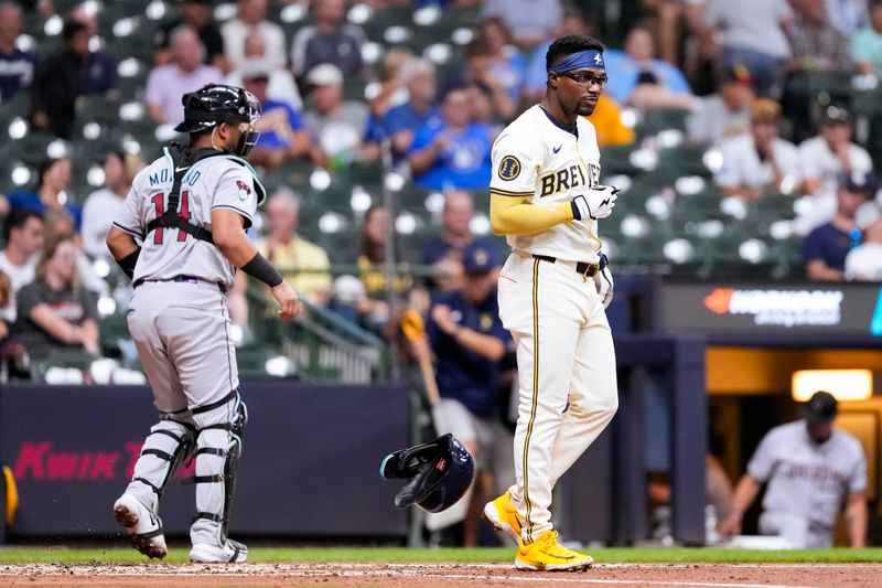 Sep 19, 2024; Milwaukee, Wisconsin, USA;  Milwaukee Brewers third baseman Andruw Monasterio (14) flips his helmet after striking out during the third inning against the =x= at American Family Field. Mandatory Credit: Jeff Hanisch-Imagn Images