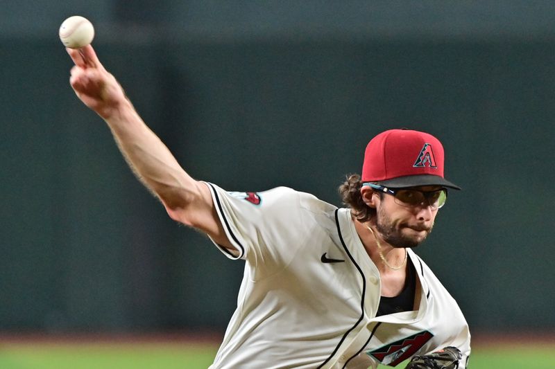 Sep 25, 2024; Phoenix, Arizona, USA; Arizona Diamondbacks pitcher Zac Gallen (23) throws in the first inning against the San Francisco Giants at Chase Field. Mandatory Credit: Matt Kartozian-Imagn Images