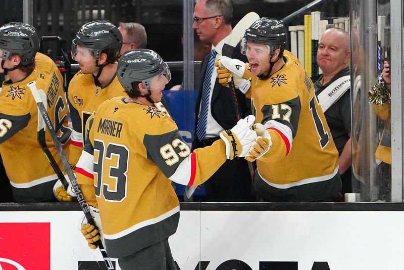 Feb 5, 2026; Las Vegas, Nevada, USA; Vegas Golden Knights right wing Mitch Marner (93) celebrates with defenseman Ben Hutton (17) after scoring a goal against the Los Angeles Kings during the first period at T-Mobile Arena. Mandatory Credit: Stephen R. Sylvanie-Imagn Images