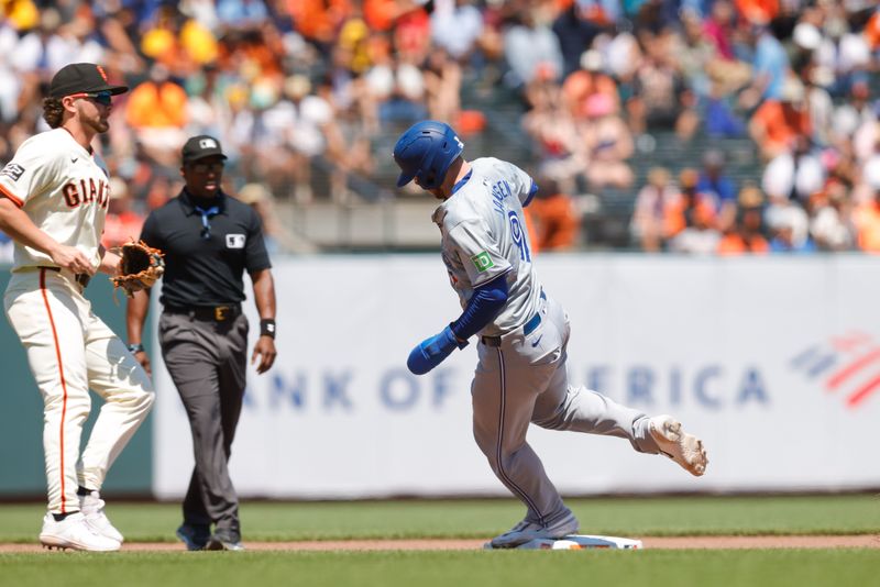 Jul 11, 2024; San Francisco, California, USA; Toronto Blue Jays catcher Danny Jansen (9) advances to third base during the eighth inning against the San Francisco Giants at Oracle Park. Mandatory Credit: Sergio Estrada-USA TODAY Sports