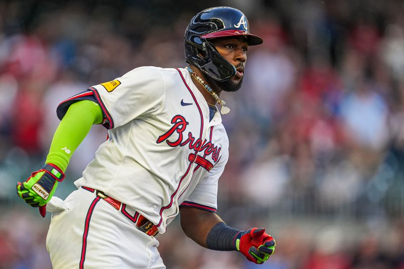 Apr 23, 2024; Cumberland, Georgia, USA; Atlanta Braves outfielder Michael Harris II (23) runs after hitting a double to drive in a run against the Miami Marlins during the second inning at Truist Park. Mandatory Credit: Dale Zanine-USA TODAY Sports