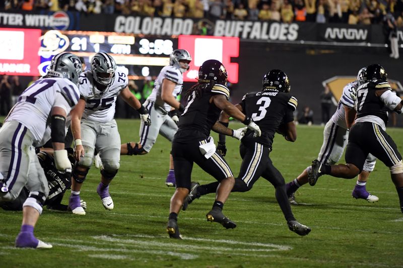 Oct 12, 2024; Boulder, Colorado, USA; Colorado Buffaloes cornerback Colton Hood (3) runs with the ball after an interception during the second half against the Kansas State Wildcats at Folsom Field. Mandatory Credit: Christopher Hanewinckel-Imagn Images