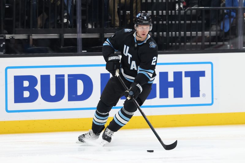 Nov 15, 2024; Salt Lake City, Utah, USA; Utah Hockey Club defenseman Olli Maatta (2) controls the puck against the Vegas Golden Knights during the first period at Delta Center. Mandatory Credit: Rob Gray-Imagn Images