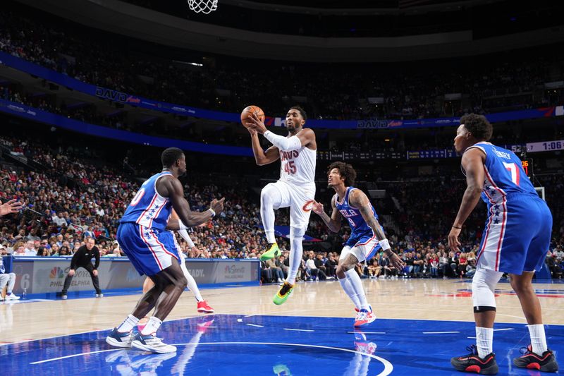 PHILADELPHIA, PA - NOVEMBER 13: Donovan Mitchell #45 of the Cleveland Cavaliers drives to the basket during the game against the Philadelphia 76ers on November 13, 2024 at the Wells Fargo Center in Philadelphia, Pennsylvania NOTE TO USER: User expressly acknowledges and agrees that, by downloading and/or using this Photograph, user is consenting to the terms and conditions of the Getty Images License Agreement. Mandatory Copyright Notice: Copyright 2024 NBAE (Photo by Jesse D. Garrabrant/NBAE via Getty Images)