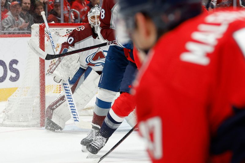 Feb 13, 2024; Washington, District of Columbia, USA; Colorado Avalanche goaltender Alexandar Georgiev (40) prepares to make a save on Washington Capitals left wing Beck Malenstyn (47) in the second period at Capital One Arena. Mandatory Credit: Geoff Burke-USA TODAY Sports