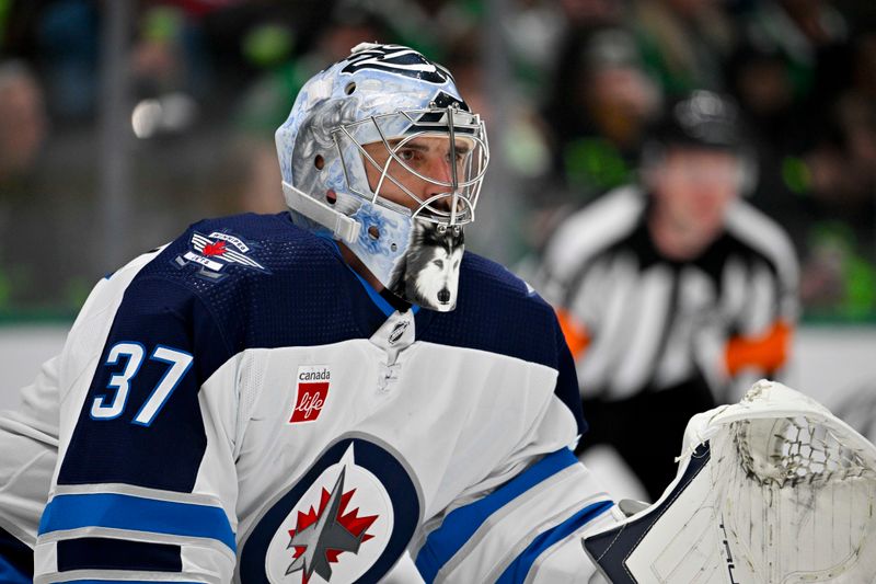 Feb 29, 2024; Dallas, Texas, USA; Winnipeg Jets goaltender Connor Hellebuyck (37) faces the Dallas Stars attack during the second period at the American Airlines Center. Mandatory Credit: Jerome Miron-USA TODAY Sports