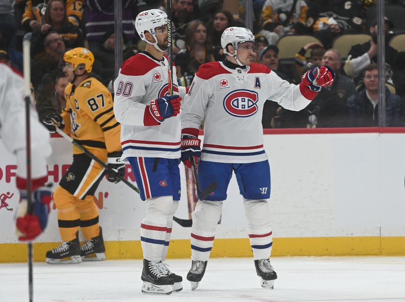 Dec 11, 2025; Pittsburgh, Pennsylvania, USA;  Montreal Canadiens right wing Brendan Gallagher (11) celebrates a goal with center Joseph Veleno (90) as Pittsburgh Penguins center Sidney Crosby (87) skates by during the second period at PPG Paints Arena. Mandatory Credit: Philip G. Pavely-Imagn Images