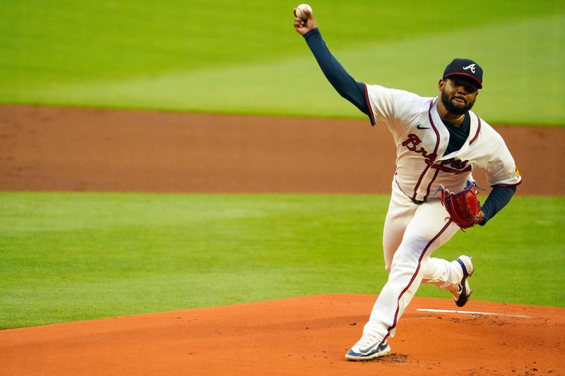 May 13, 2024; Cumberland, Georgia, USA; Atlanta Braves pitcher Reynaldo Lopez (40) fires a pitch against the Chicago Cubs during the first inning at Truist Park. Mandatory Credit: John David Mercer-USA TODAY Sports