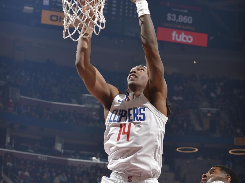 CLEVELAND, OH - JANUARY 29: Terance Mann #14 of the LA Clippers dunks the ball during the game against the Cleveland Cavaliers on January 29, 2024 at Rocket Mortgage FieldHouse in Cleveland, Ohio. NOTE TO USER: User expressly acknowledges and agrees that, by downloading and/or using this Photograph, user is consenting to the terms and conditions of the Getty Images License Agreement. Mandatory Copyright Notice: Copyright 2024 NBAE (Photo by David Liam Kyle/NBAE via Getty Images)