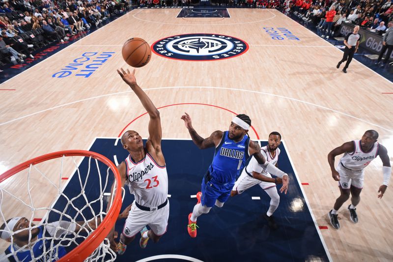 INGLEWOOD, CA - OCTOBER 14: Kai Jones #23 of the LA Clippers block during the game against the Dallas Mavericks on October 14, 2024 at Intuit Dome in Los Angeles, California. NOTE TO USER: User expressly acknowledges and agrees that, by downloading and/or using this Photograph, user is consenting to the terms and conditions of the Getty Images License Agreement. Mandatory Copyright Notice: Copyright 2024 NBAE (Photo by Juan Ocampo/NBAE via Getty Images)